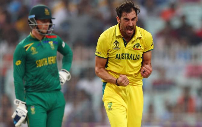 Australia's Mitchell Starc celebrates after taking the wicket of South Africa's Aiden Markram 