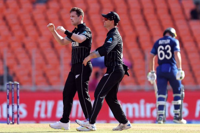 New Zealand's Matt Henry celebrates after taking the wicket of England skipper Jos Buttler
