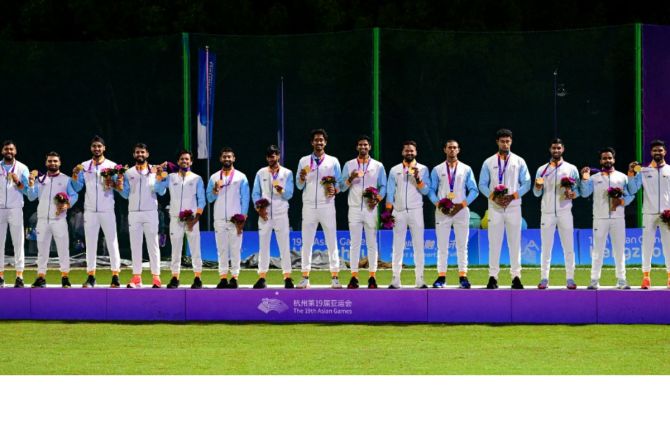 The Asian Games gold medal-winning Indian men's cricket team on the podium