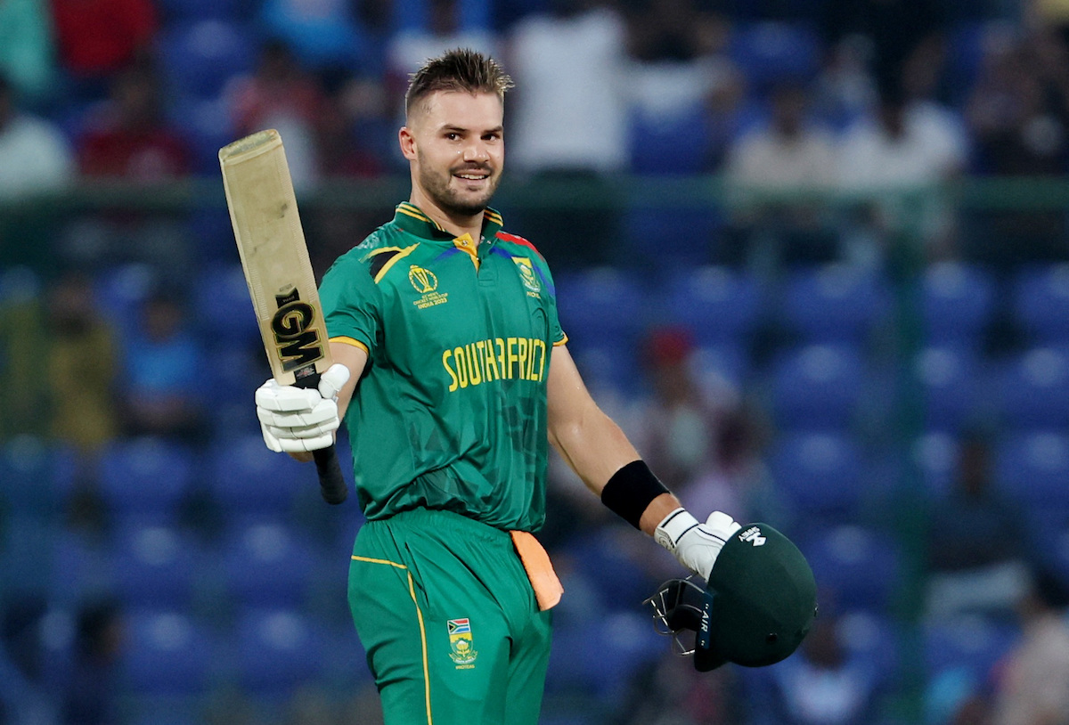 South Africa's Aiden Markram celebrates after reaching his century, the fastest ODI World Cup hundred, off 49 balls 
