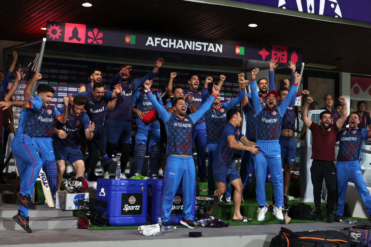 The Afghanistan team celebrate in the dug out after a thumping win over Pakistan