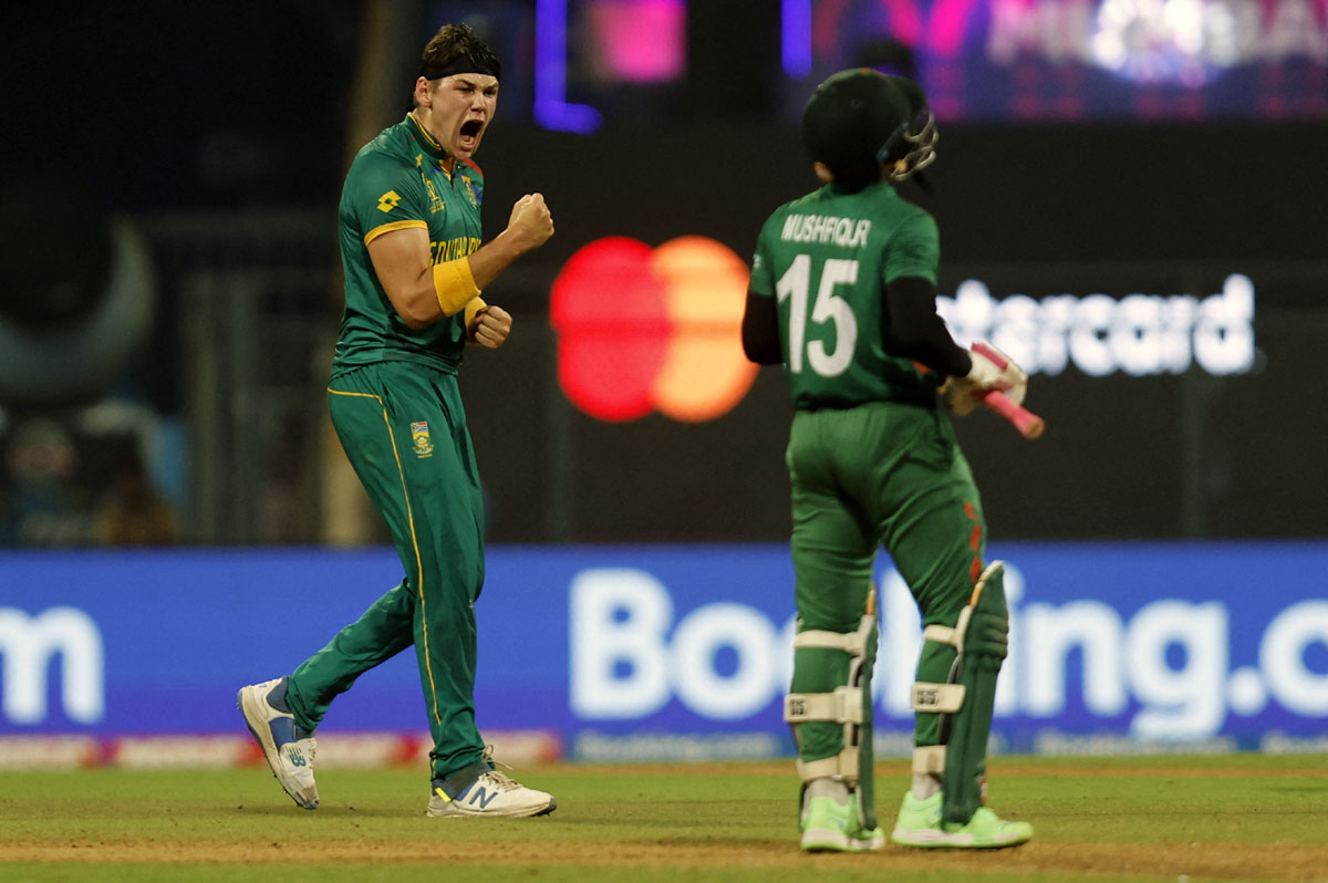 South Africa's Gerald Coetzee celebrates after taking the wicket of Bangladesh's Mushfiqur Rahim