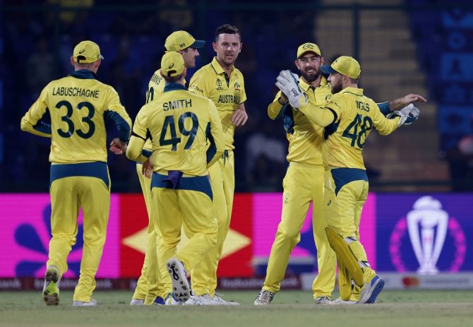 Australia's Glenn Maxwell celebrates with teammates after the dismissal of Netherlands' Vikramjit Singh