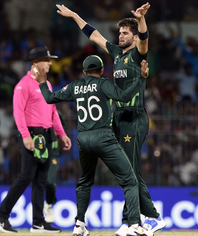 Pakistan pacer Shaheen Afridi celebrates with Babar Azam after taking the wicket of South Africa opener Quinton de Kock.