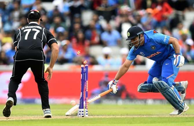 Mahendra Singh Dhoni is run out by a direct hit from Martin Guptill during the 2019 World Cup semi-final against New Zealand. 