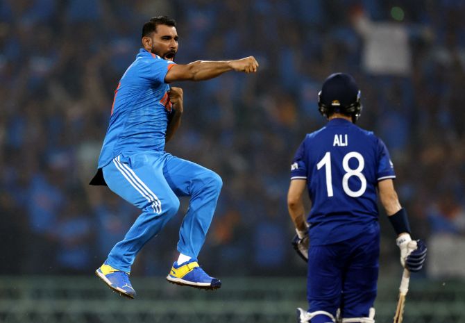 Mohammed Shami celebrates after taking the wicket of Moeen Ali