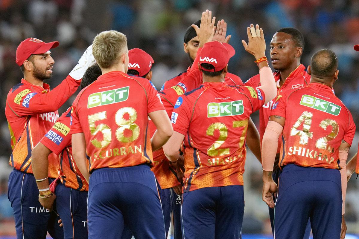 Punjab Kings' players celebrate after Kagiso Rabada dismissed Wriddhiman Saha.