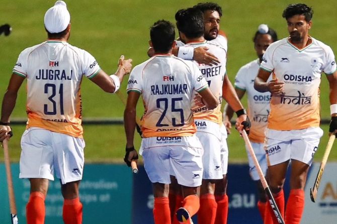 India players celebrate after Harmanpreet Singh scores the opening goal through a penalty corner