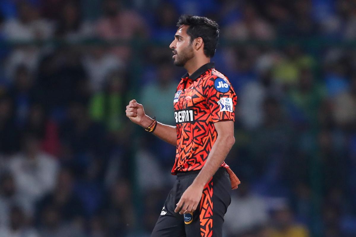 Bhuvneshwar Kumar celebrates dismissing Delhi Capitals opener David Warner.