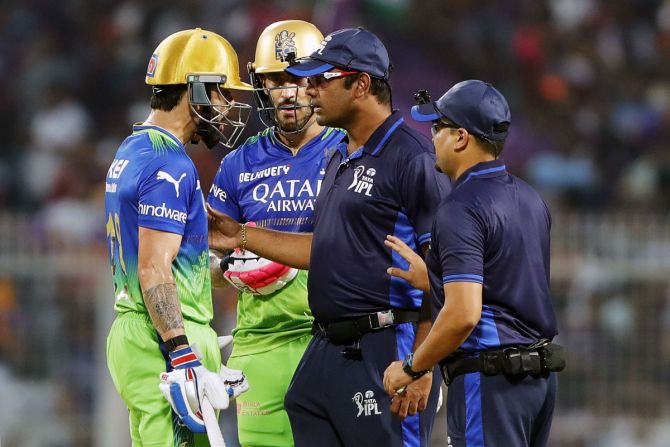 Virat Kohli argues with umpires after losing the DRS review over his caught and bowled decision off the bowling of Harshit Rana.