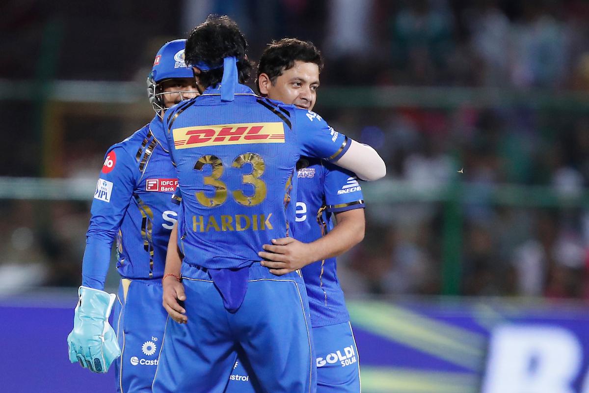 Piyush Chawla celebrates Jos Buttler’s wicket.