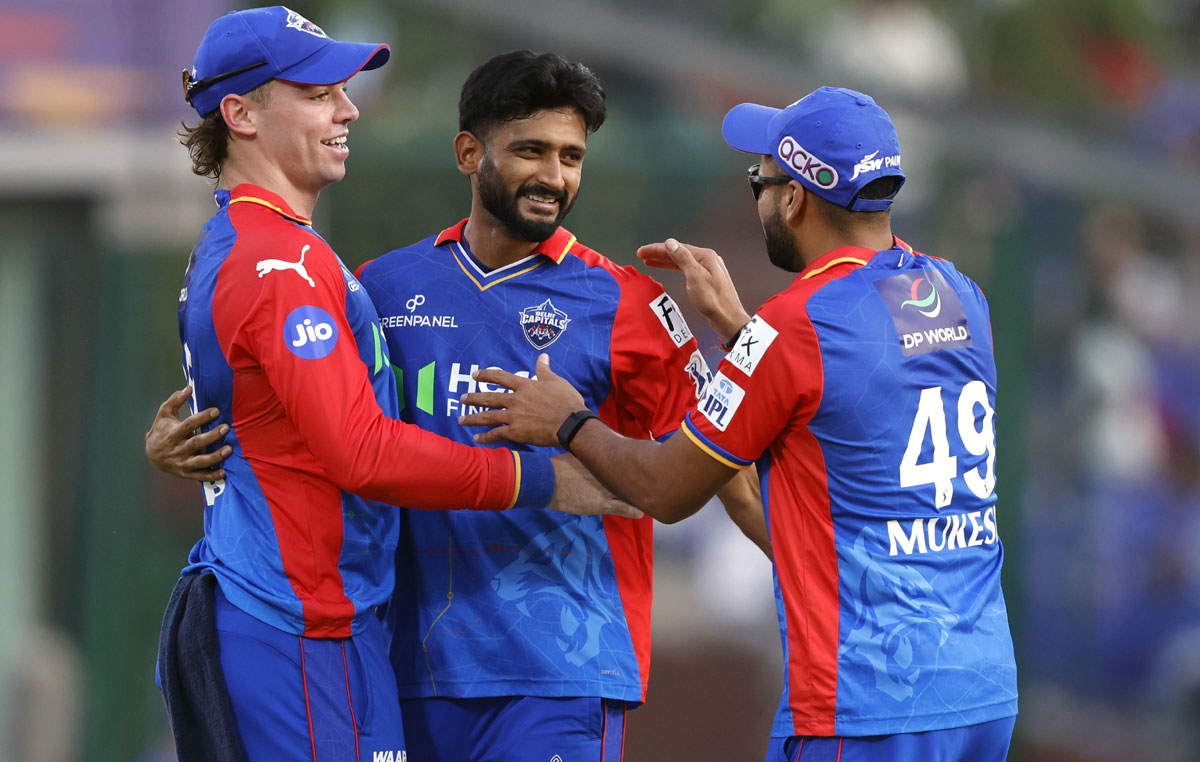 Delhi Capitals' players celebrate the wicket of Rohit Sharma.