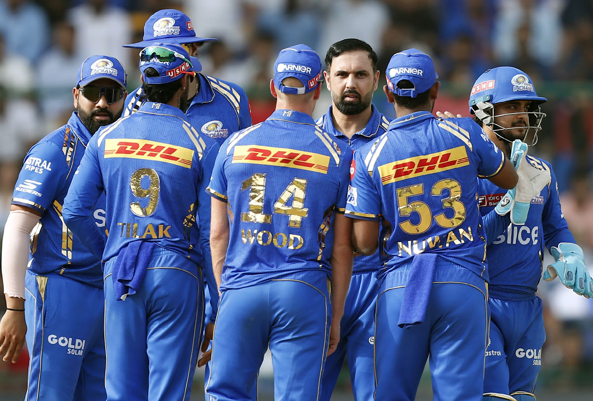 Mumbai Indians' players celebrate after Mohammad Nabi dismisses Abishek Porel.