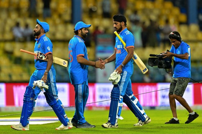 Rohit Sharma greets his players after their loss in the 2nd ODI against Sri Lanka in Colombo, on Sunday