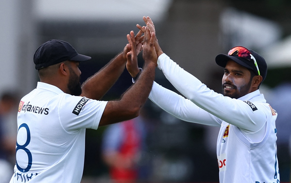 Lahiru Kumara celebrates taking the catch to dismiss England opener Ben Duckett