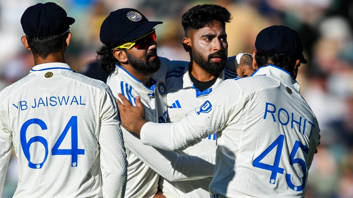 Mohammed Siraj celebrates with team-mates after taking the wicket of Travis Head on Day 2 of the second Test in Adelaide.