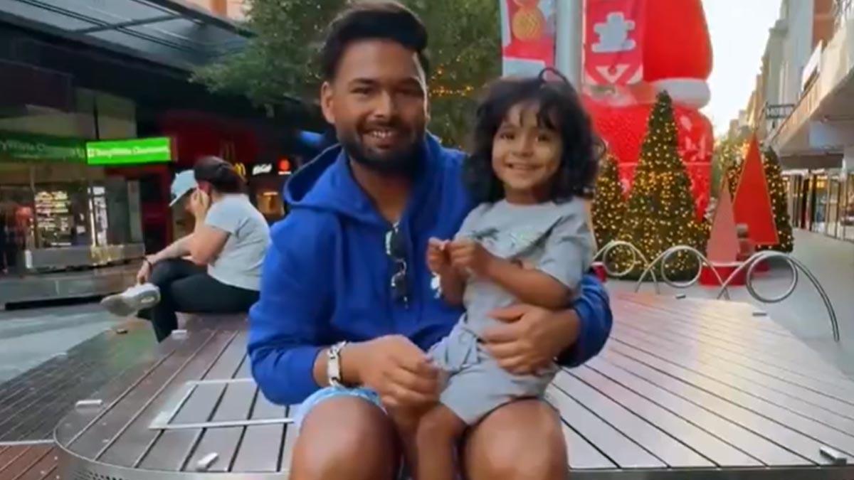 Rishabh Pant with a young fan