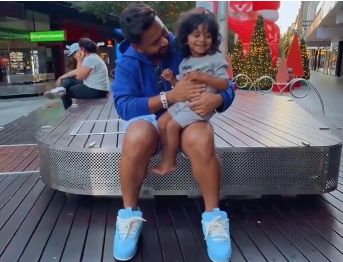 Rishabh Pant with a young fan