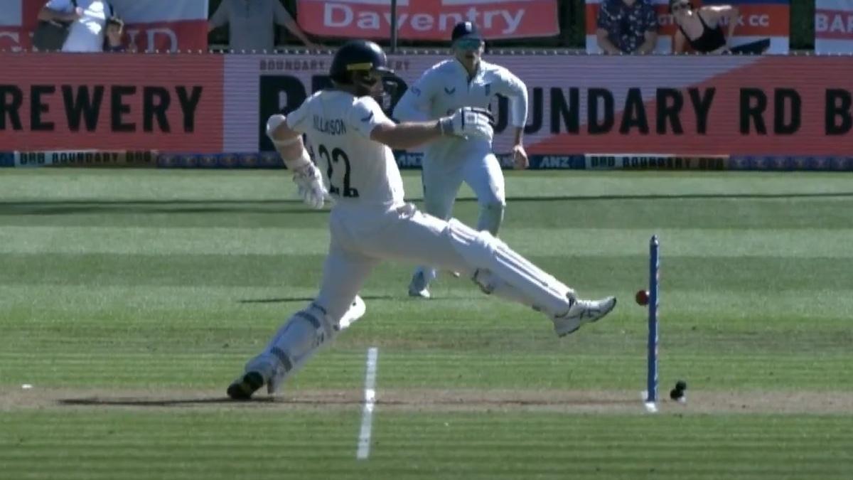 Kane Williamson tries in vain to clear the ball after it trickles back off his bat and moves on to his stumps.