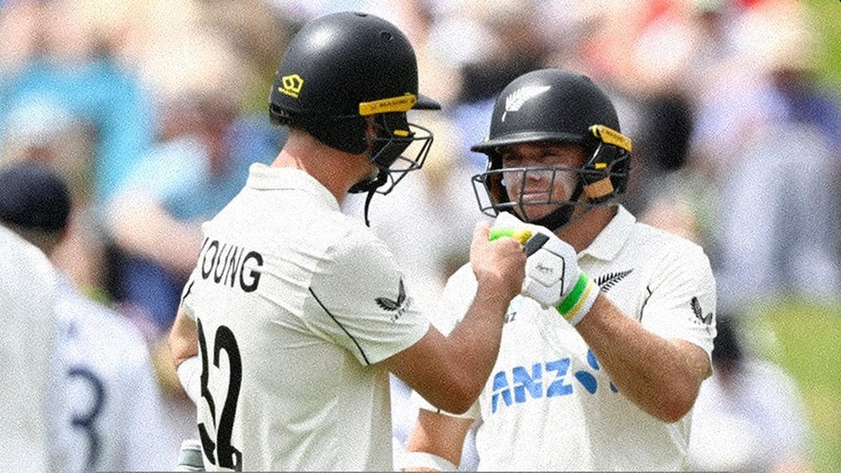 New Zealand openers Will Young and Tom Latham celebrate a boundary in the morning session on Day 1 of the third Test against England at Seddon Park, Hamilton, on Saturday.