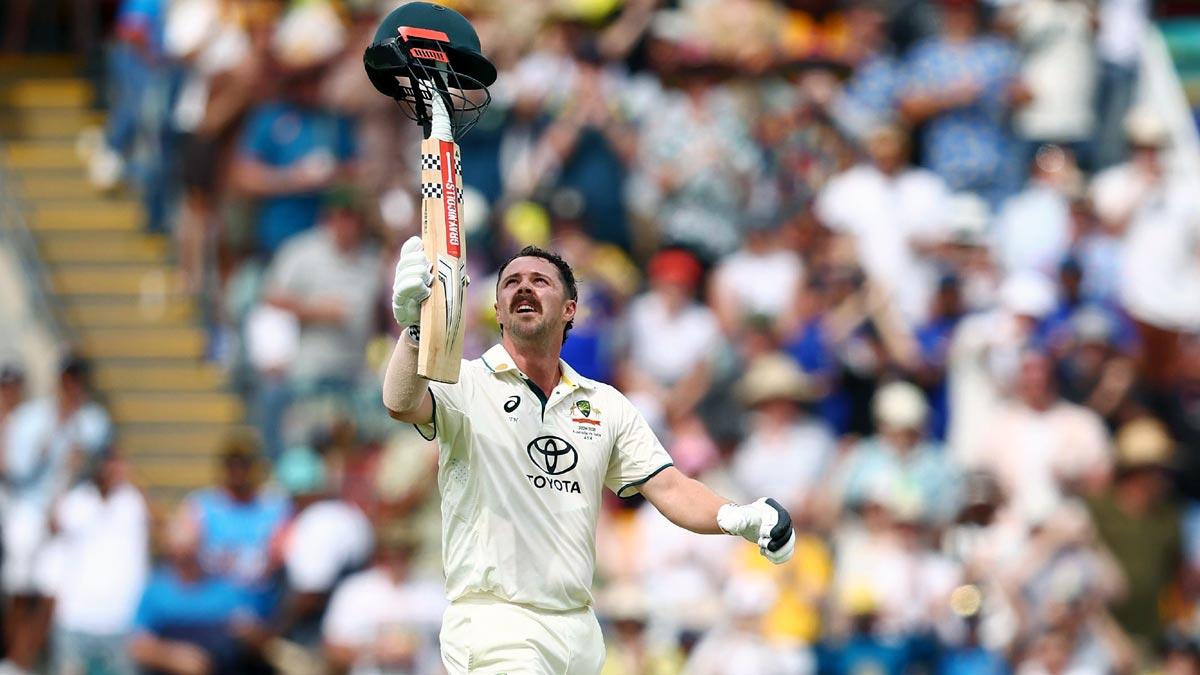 Travis Head celebrates his century