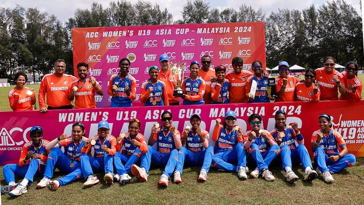 India's players pose with their medals and the trophy after beating Bangladesh in the final of the Under-19 women's Asia Cup in Kuala Lumpur on Sunday.