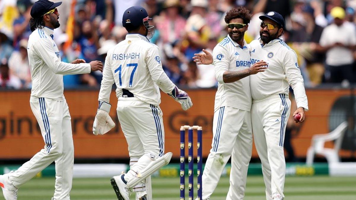 Ravindra Jadeja celebrates with teammates after taking the wicket of Sam Konstas.