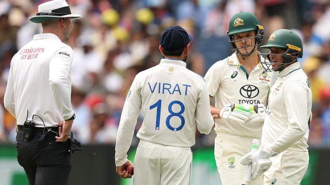 Australia's Usman Khawaja and umpire Michael Gough step in to defuse the moment after a clash of shoulders between Sam Konstas and Virat Kohli during Day 1 of the fourth Test between Australia and India at the MCG on Thursday.