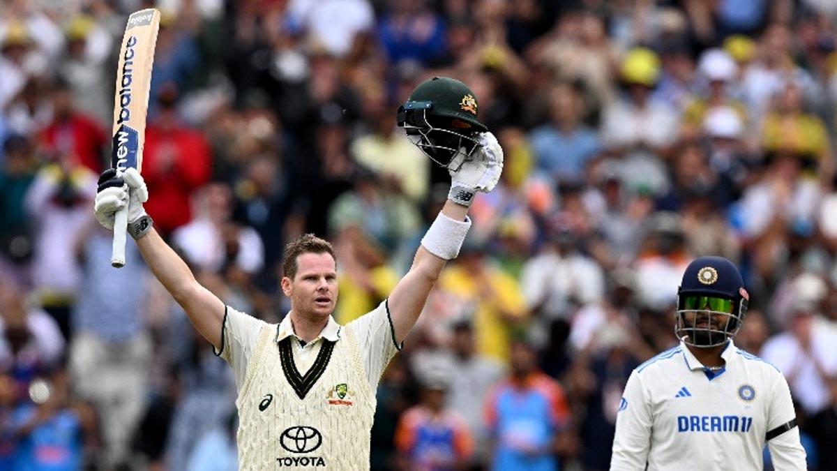 Steve Smith celebrates completing his century on Day 2 of the fourth Test against India at the MCG on Friday.