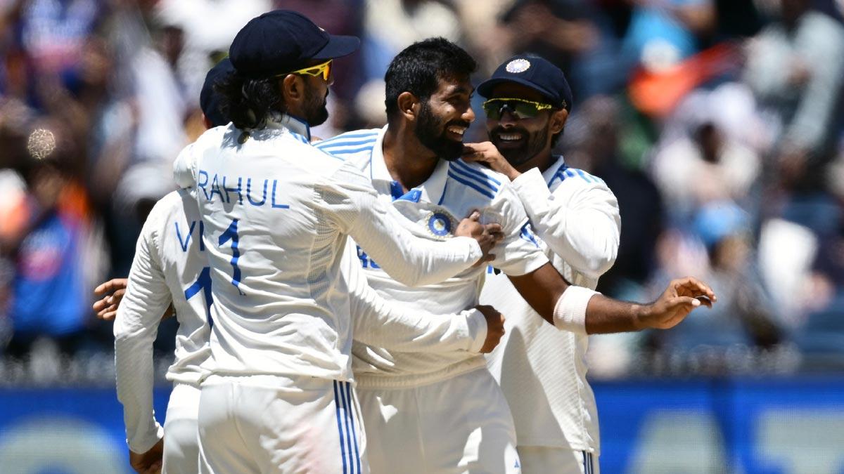 Jasprit Bumrah celebrates after taking the wicket of Alex Carey.