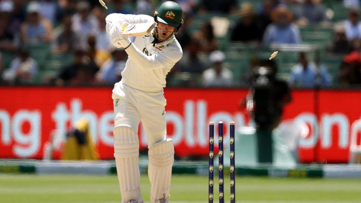 Alex Carey is bowled by Jasprit Bumrah.