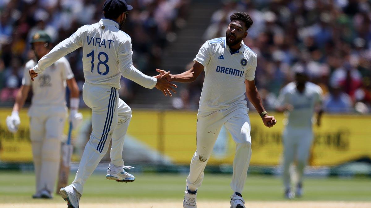 Mohammed Siraj celebrates after dismissing Steve Smith.