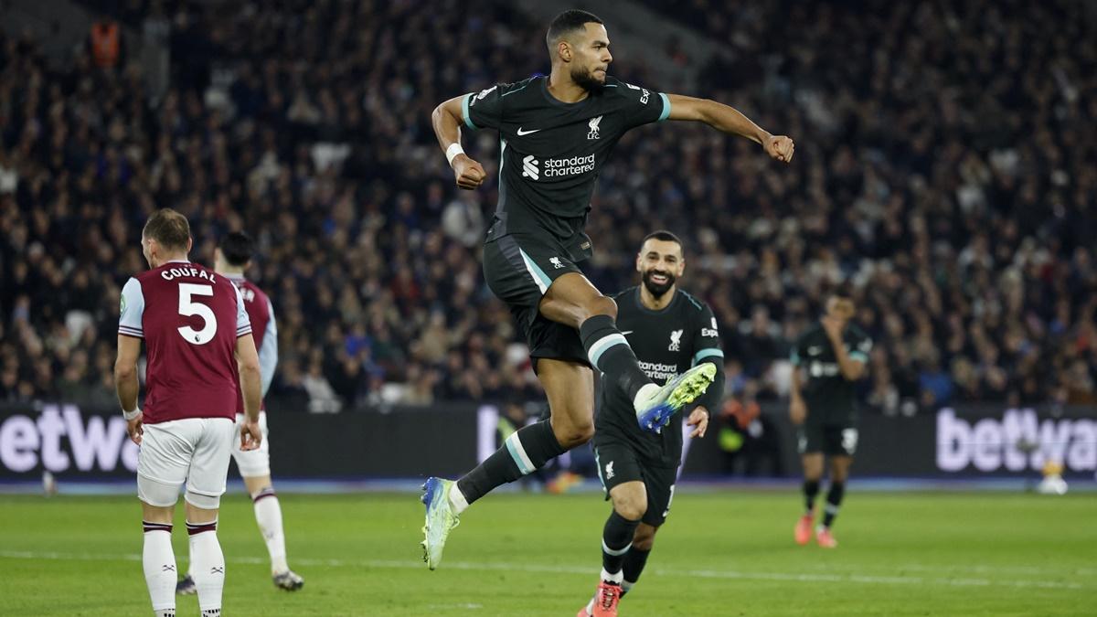 Cody Gakpo celebrates scoring Liverpool's second goal with Mohamed Salah in the Premier League match against West Ham United at London Stadium on Sunday.