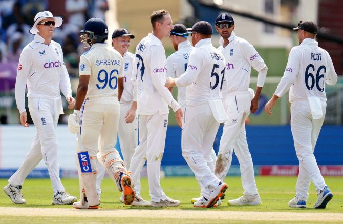 England's players celebrate the wicket of Shreyas Iyer