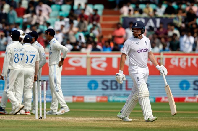 England's Jonny Bairstow walks back to the pavilion after losing his wicket, lbw bowled by India's Jasprit Bumrah following an unsuccessful DRS review