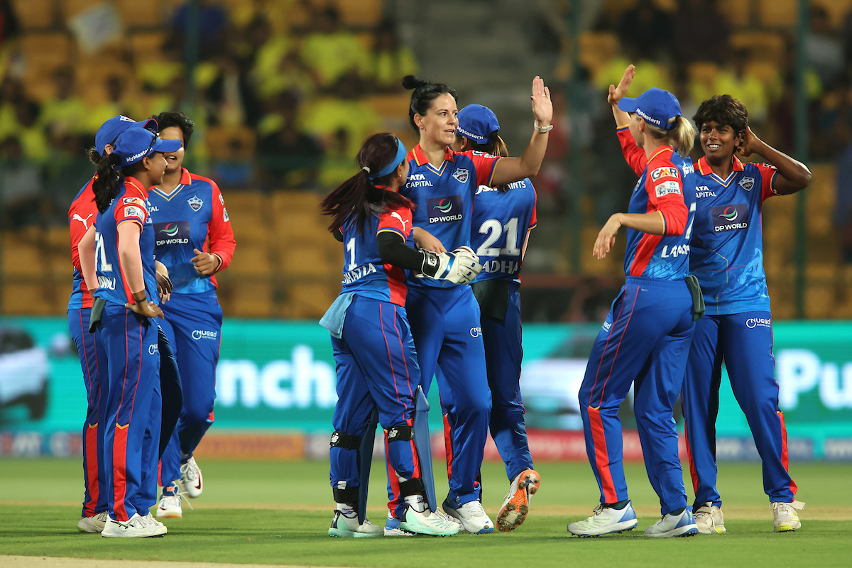 Marizanne Kapp of Delhi Capitals is congratulated for getting the wicket of Tahlia McGrath of UP Warriorz 