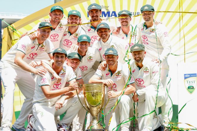 The Australian cricket team celebrate with the trophy after defeating Pakistan and sweeping the series 3-0