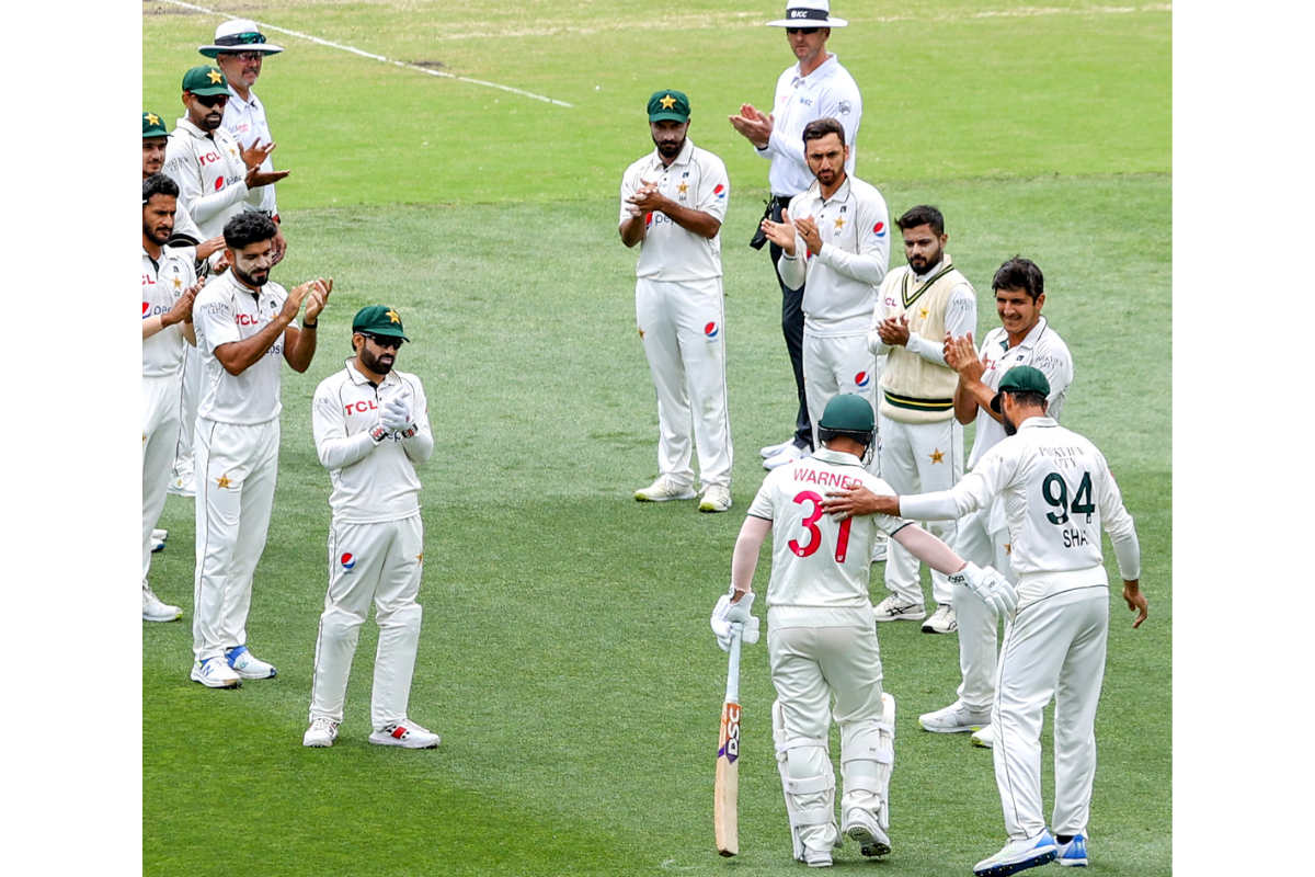 David Warner gets a guard of honour while he walks out to bat for his final Test innings on Saturday