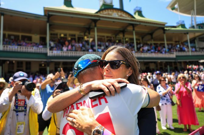 David Warner hugs wife Candice after the match on Saturday