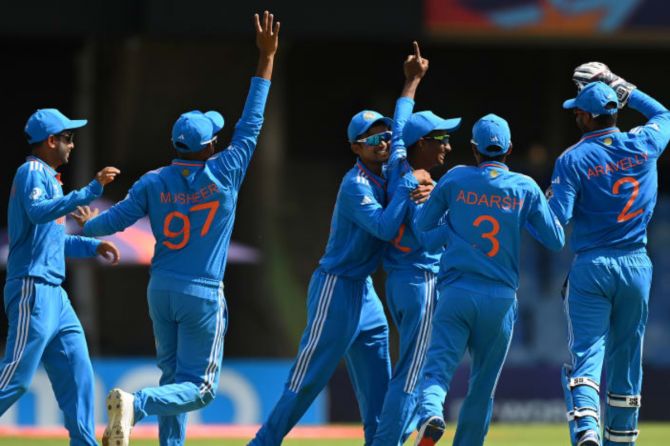 India players celebrate the fall of an Irish wicket
