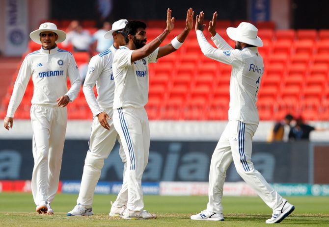 Jasprit Bumrah celebrates with team-mates after taking the wicket of Ollie Pope