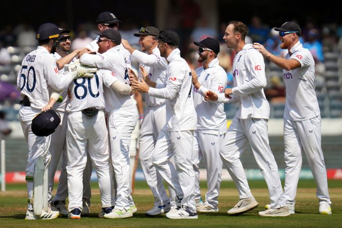 England's players celebrate the wicket of Shubman Gill