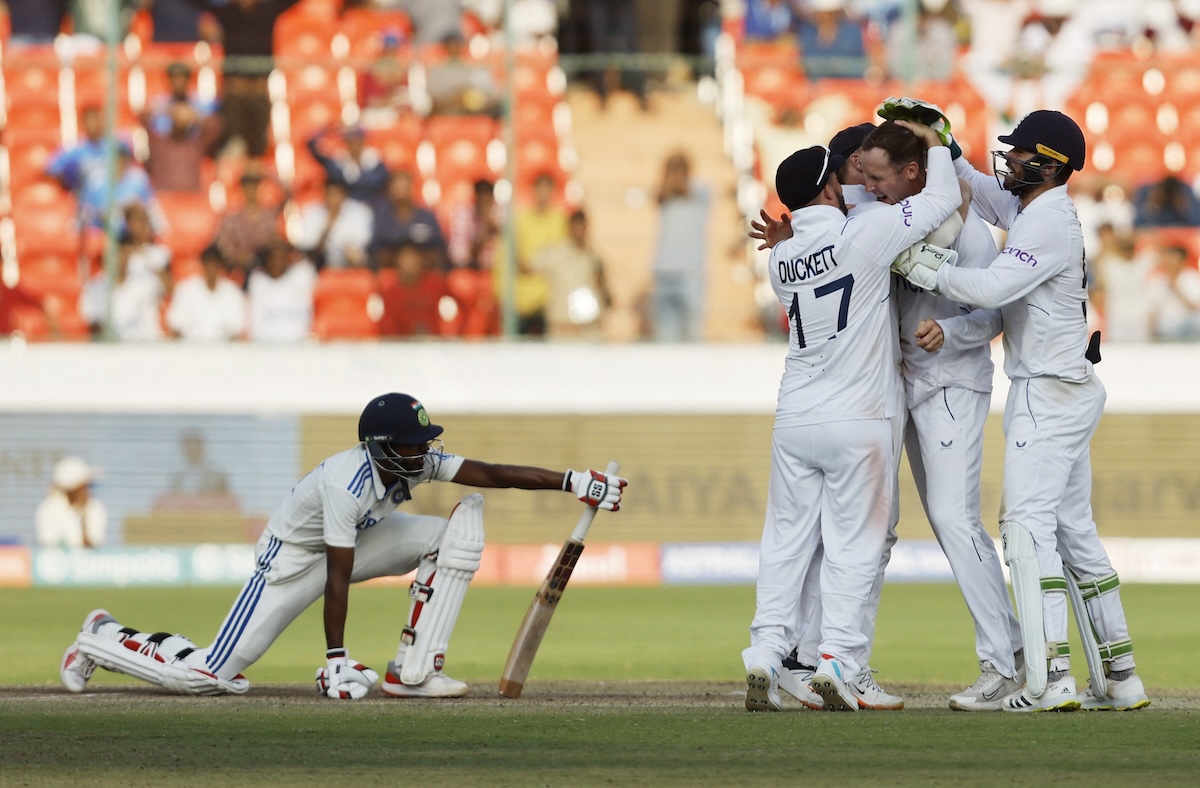  England's Tom Hartley celebrates with teammates after taking the wicket of India's Srikar Bharat