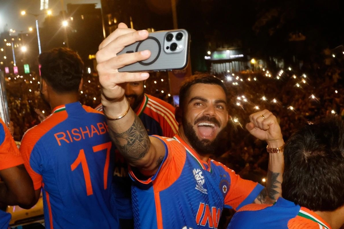 Virar Kohli takes a selfie during the victory parade in Mumbai, on Thursday