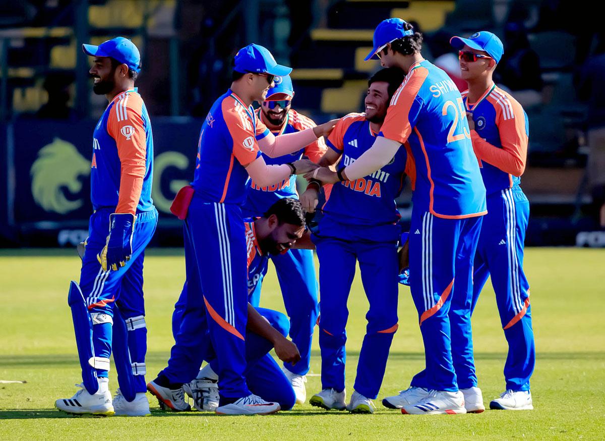 India's players celebrate a wicket of Brian Bennett