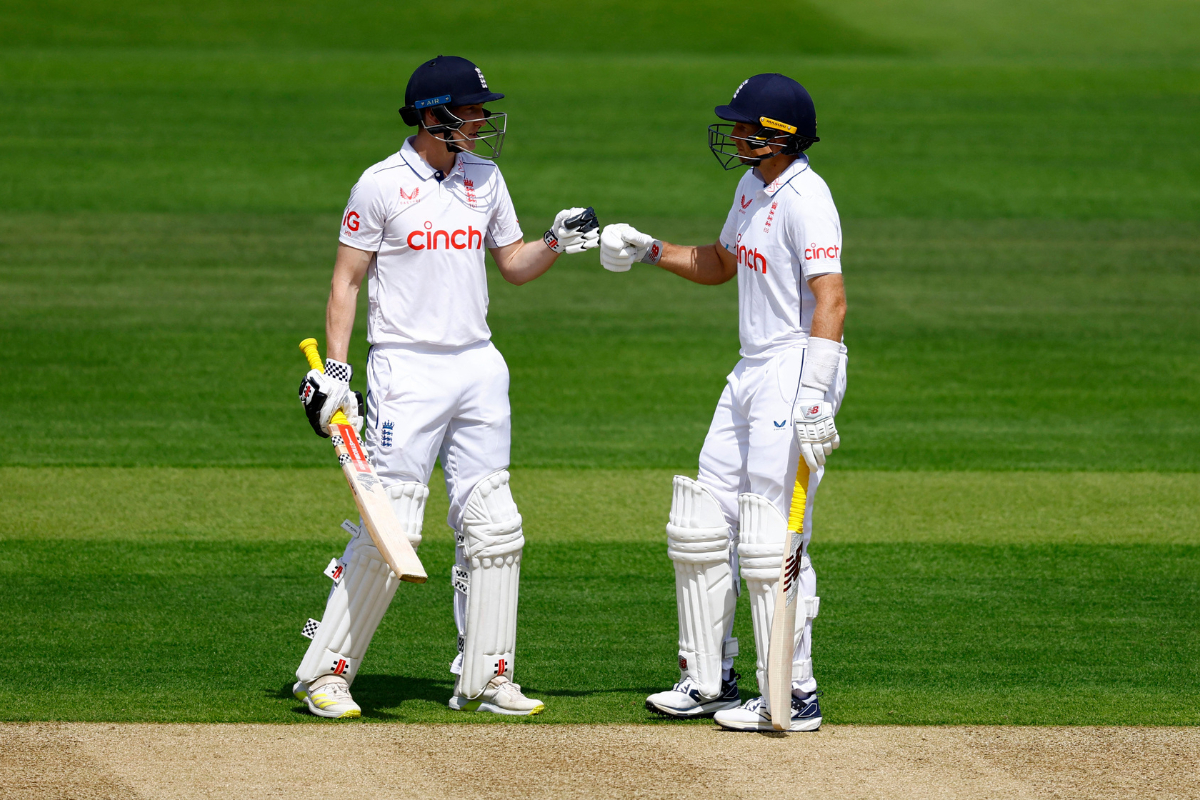 Harry Brook celebrates with Joe Root on reaching his half-century, his 12th in 13 Tests