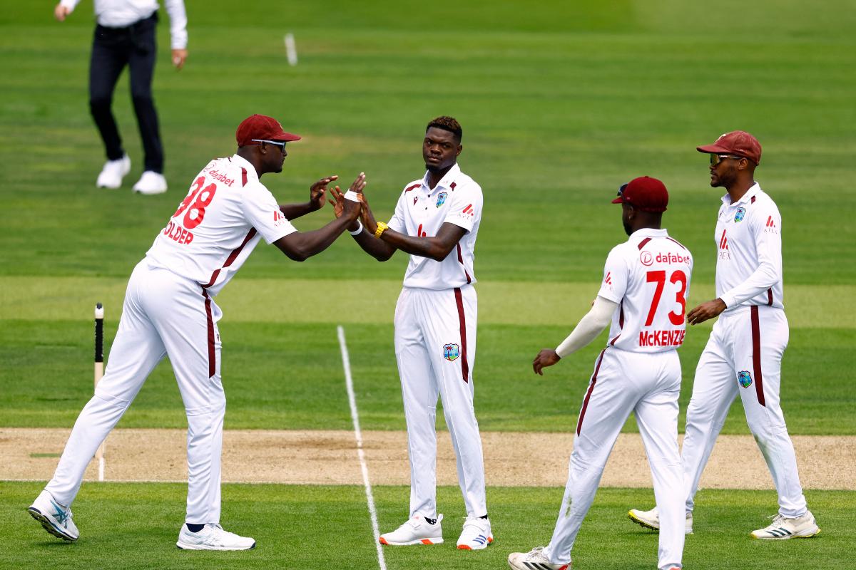 Alzarri Joseph celebrates with teammates after dismissing Harry Brook.