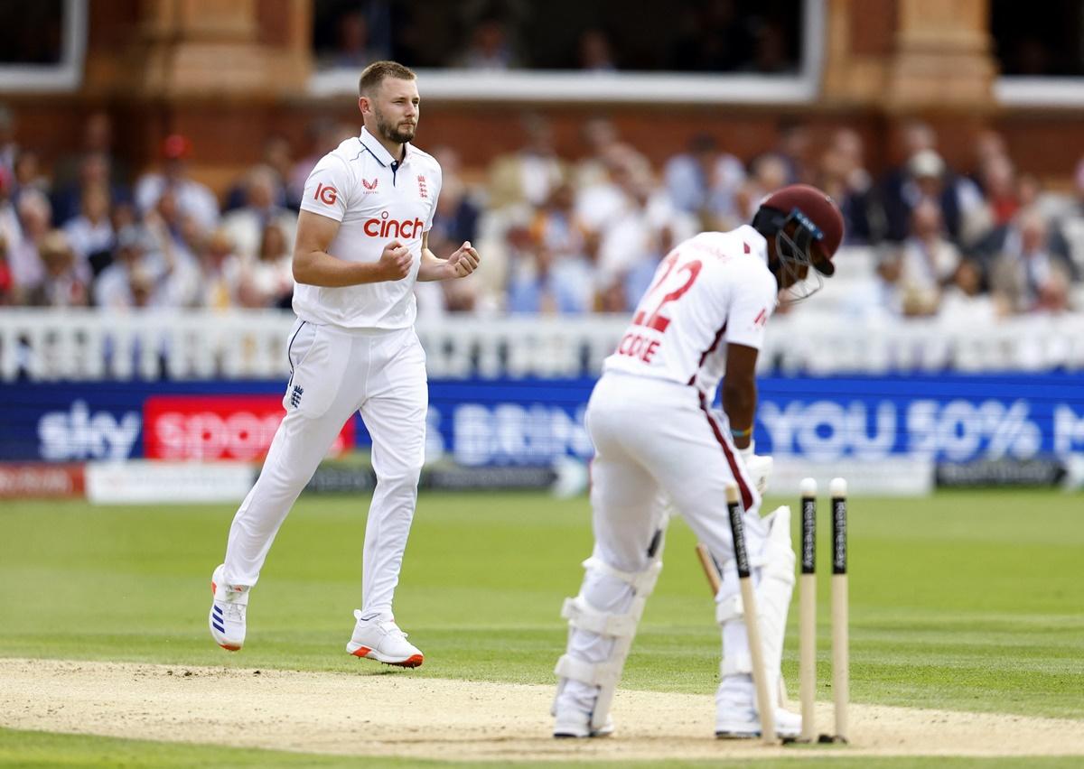 Gus Atkinson reacts after having Kavem Hodge bowled.