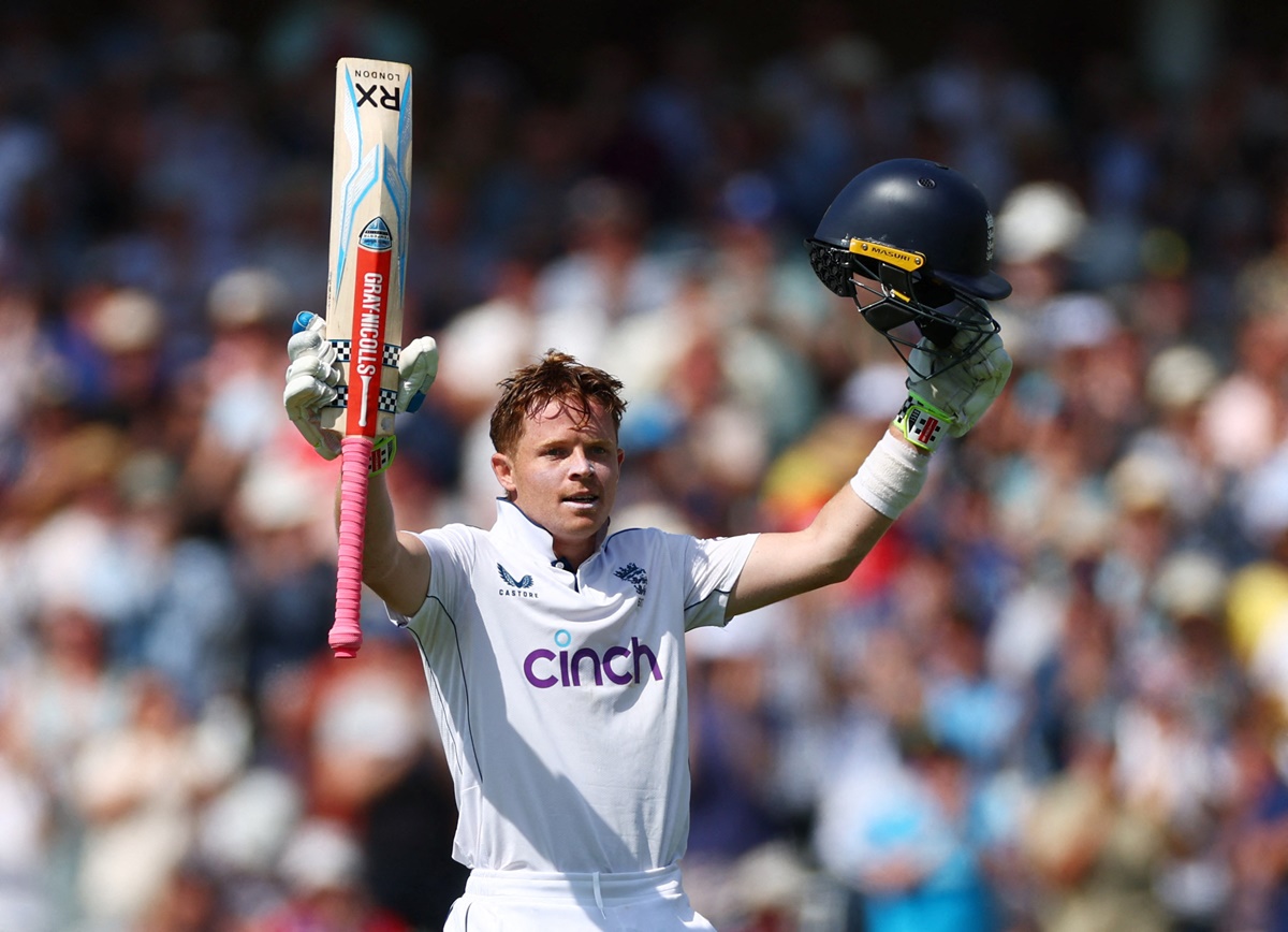 England's Ollie Pope celebrates reaching his century. 