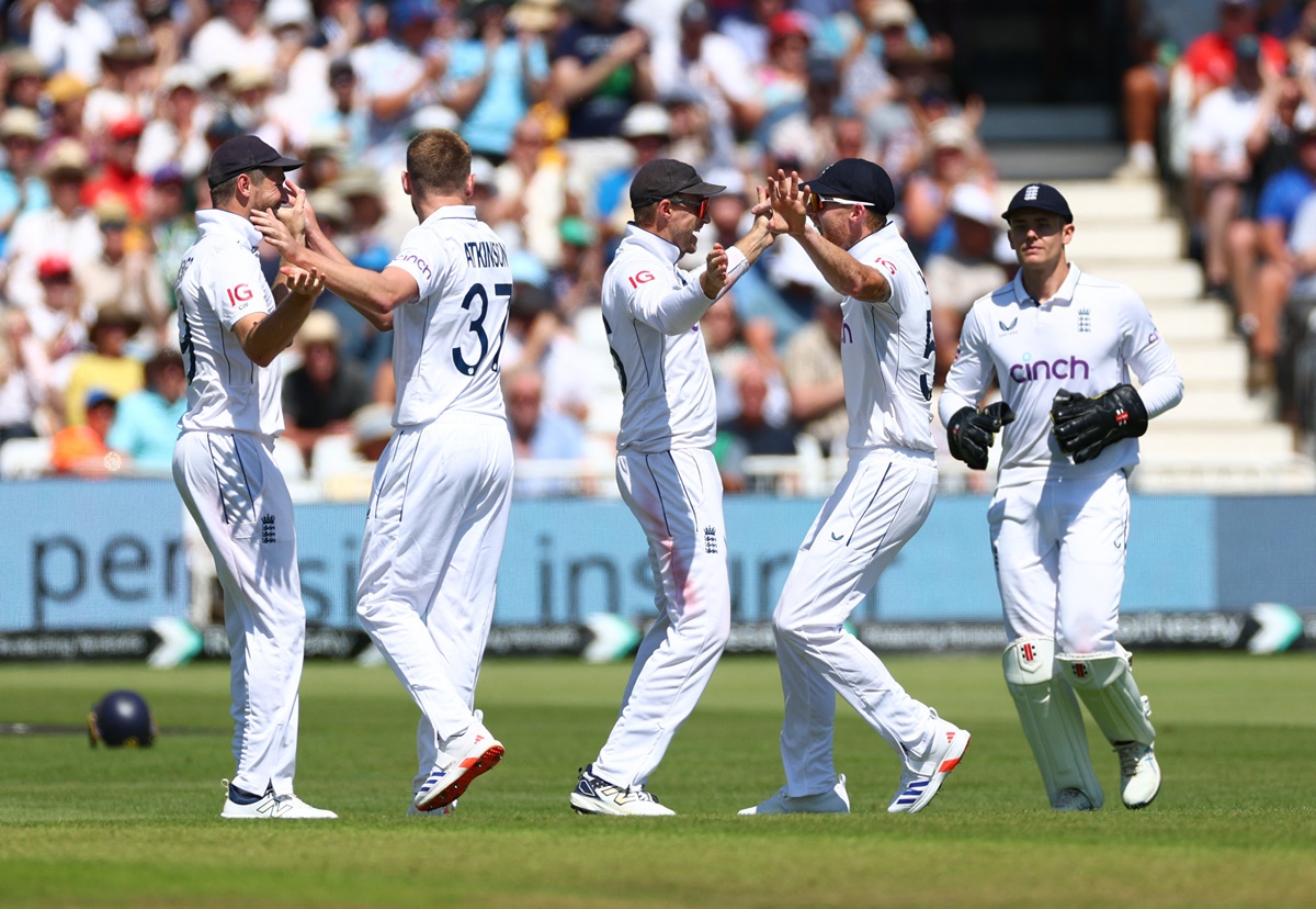 Gus Atkinson celebrates with England teammates after dismissing Kraigg Brathwaite.